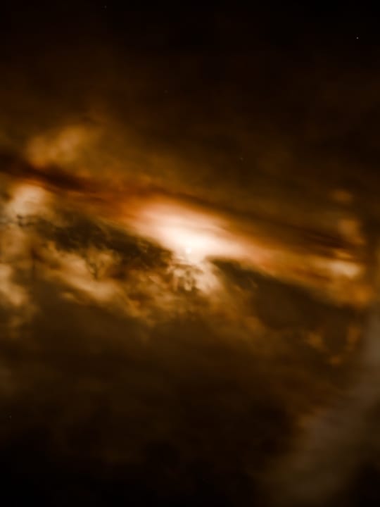 Broken warm arcs cross diagonal dust clouds around a partly obscured central star: the moment a star ignites.